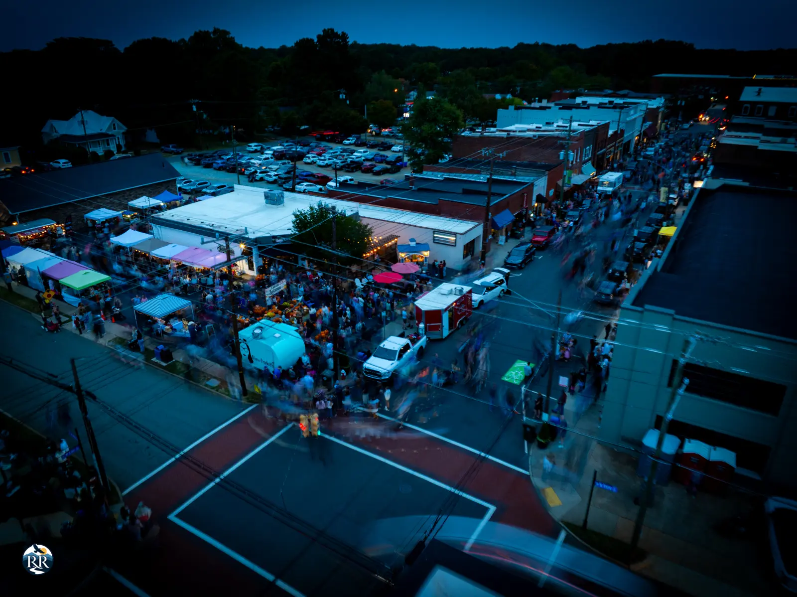 Aerial view of Downtown Mebane's Clay Street during a crowded night event called "A Night in Stars Hollow"